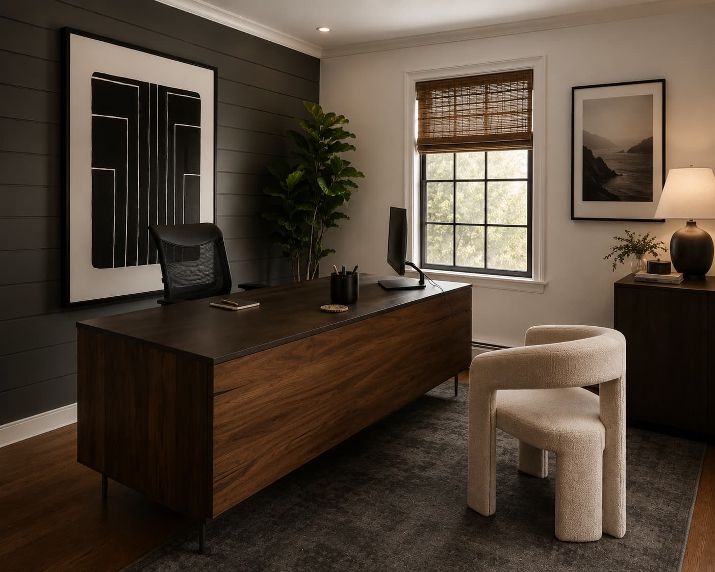 Tailored home office with a dark walnut desk, black shiplap accent wall, and graphic framed artwork
